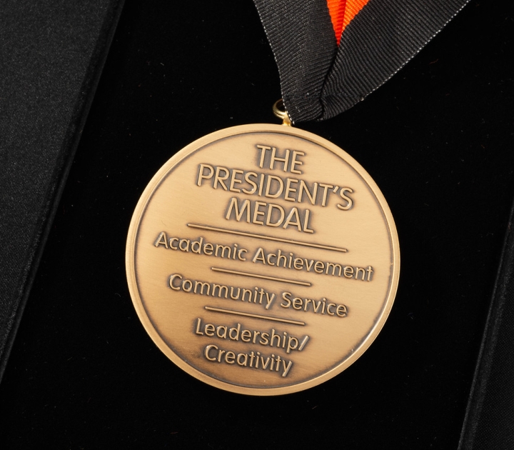 Obverse side of the President's Medal with the words Academic Achievement, Community Service, Leadership/Creativity