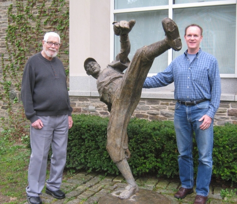  Loren and Jim Keller alongside a statue of Satchel Paige in Cooperstown.