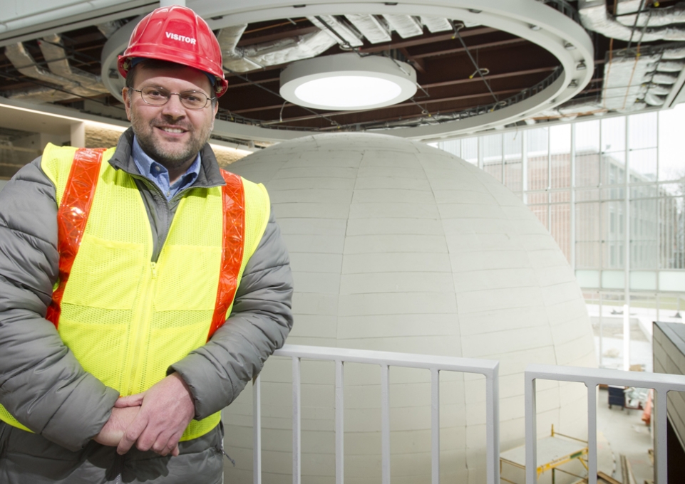Kevin Williams with the new planetarium behind him