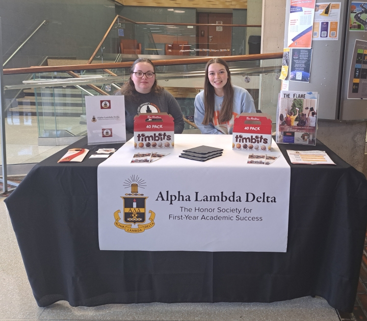 Two ALD members at a tabling event for Alpha Lambda Delta
