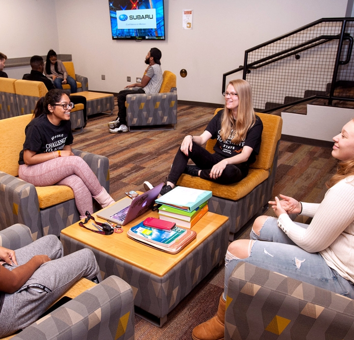 Students lounging in Caudell Hall 