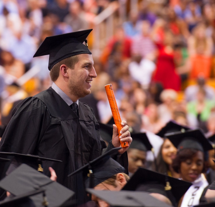 Commencement student with diploma