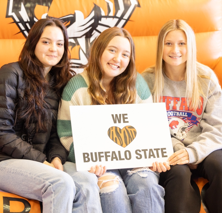 Students hold "We love Buffalo State" banner 
