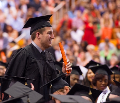 Commencement student with diploma