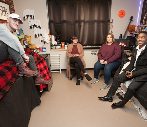 Students sitting in dorm room 