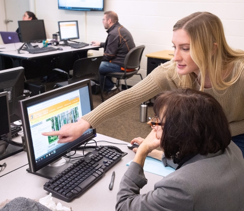 Faculty and staff in a workshop with computers