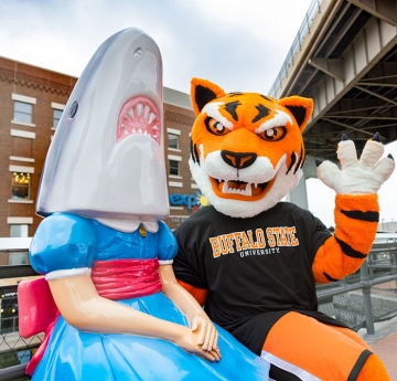 Benji sitting next to Shark Girl