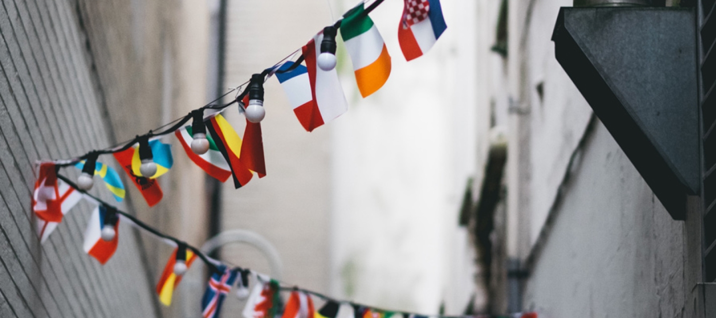 Bunting of international flags in an alley