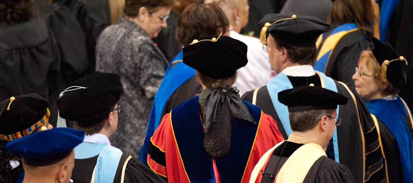 Faculty wearing regalia at Commencement ceremony