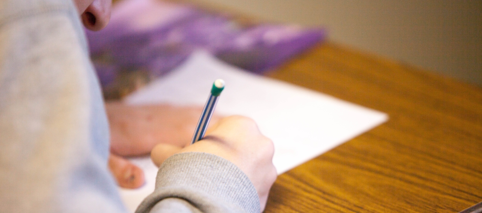 Student taking test at desk