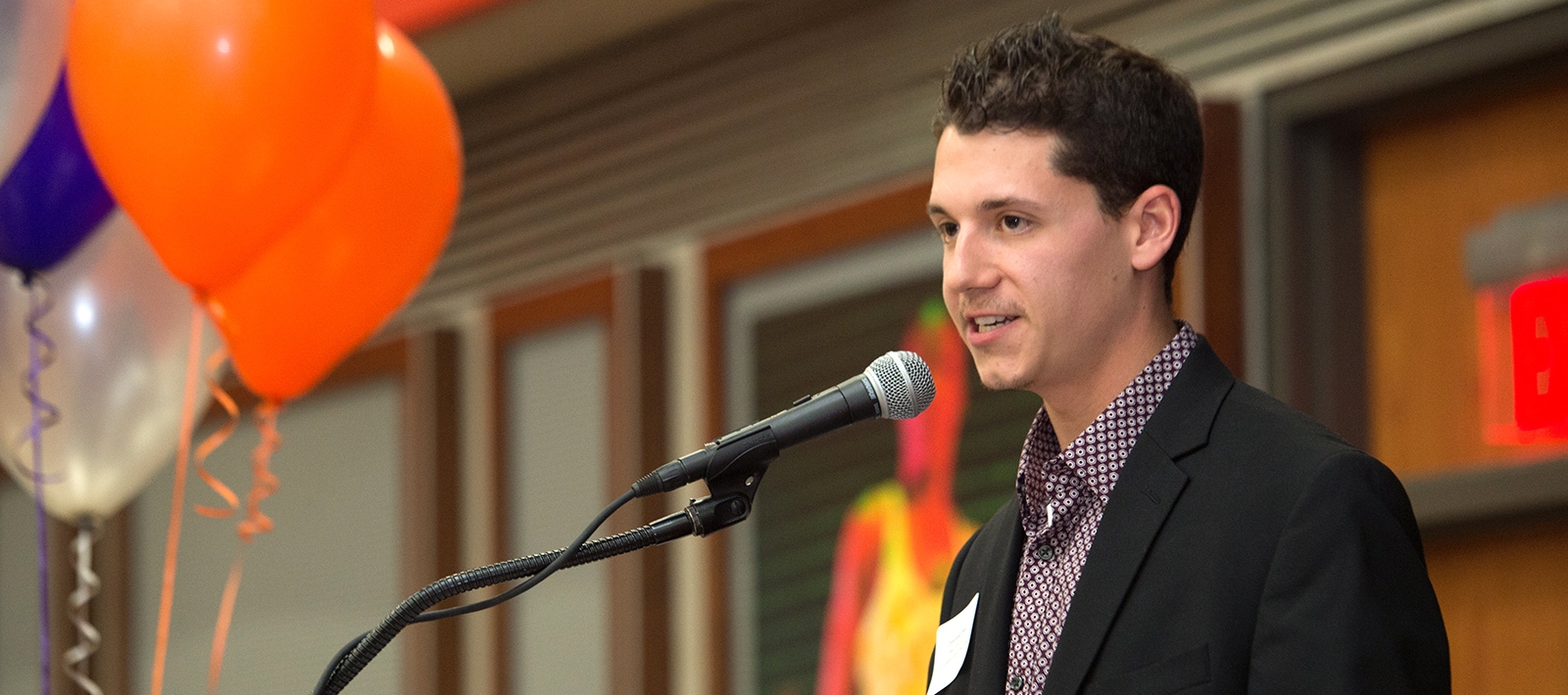 Student speaking at a podium