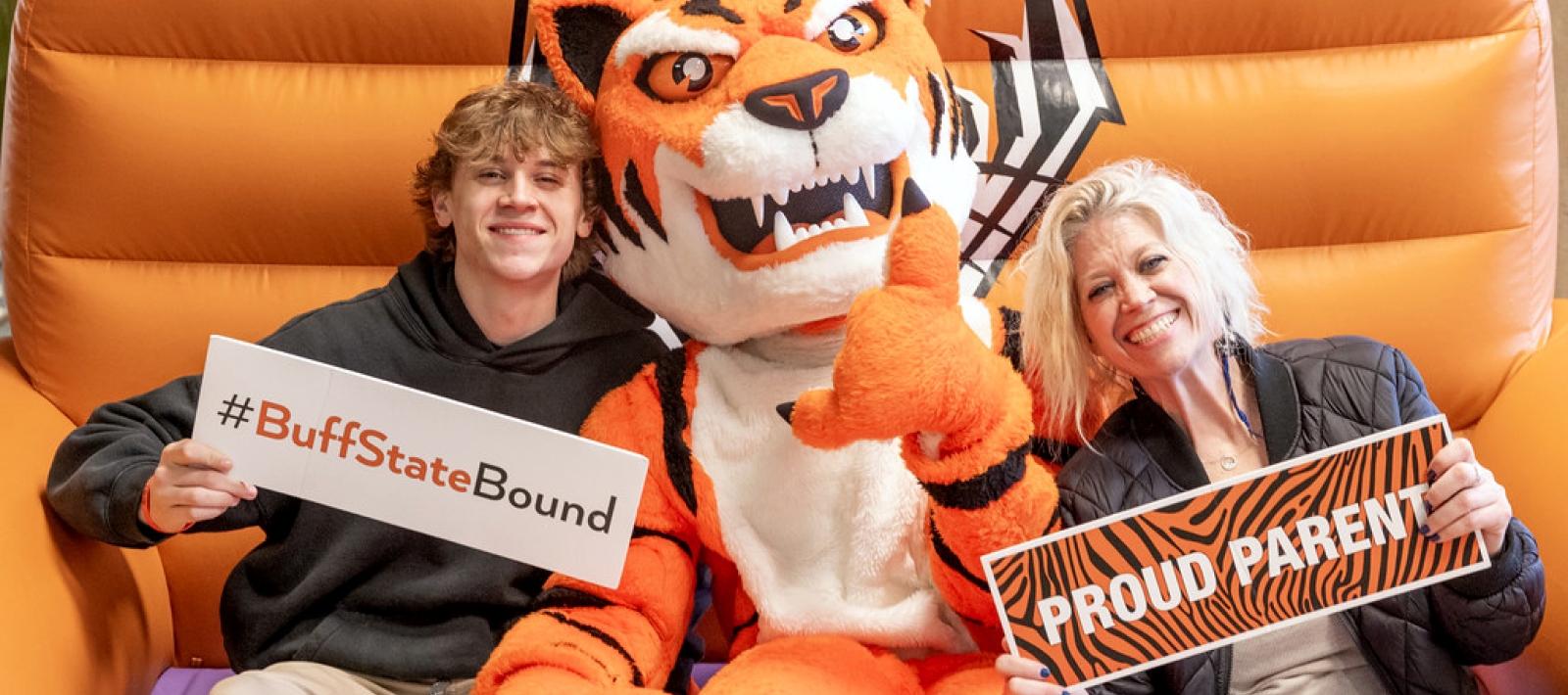 Two people sitting with the Bengal