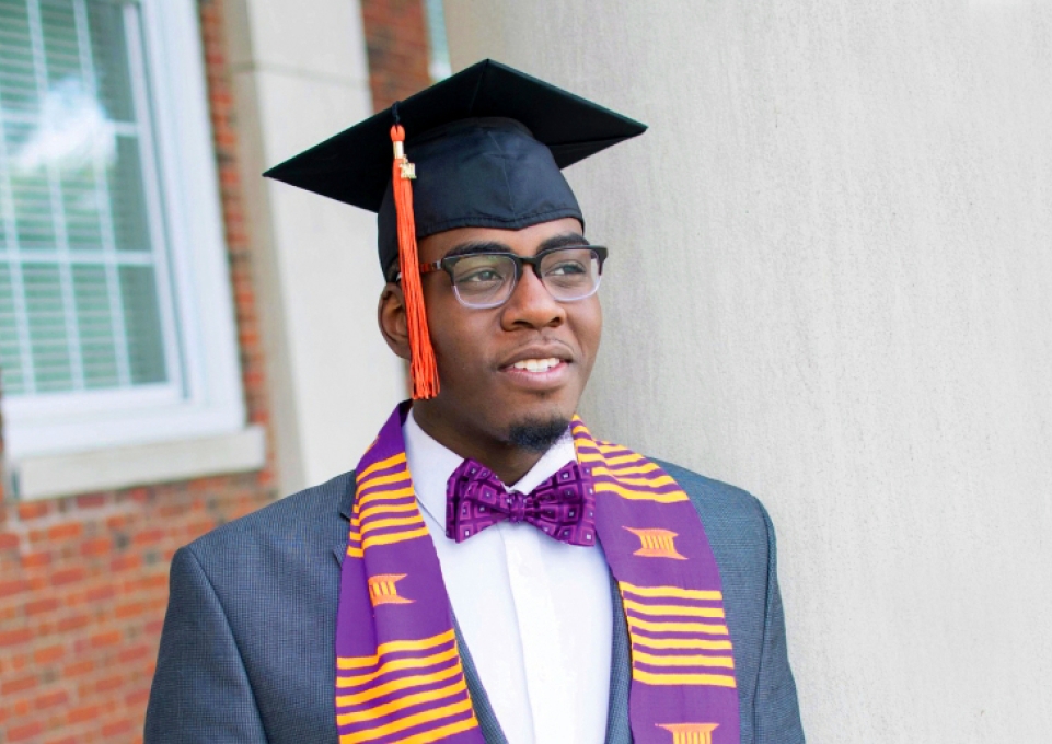 Nicholas Irion in suit and mortar board